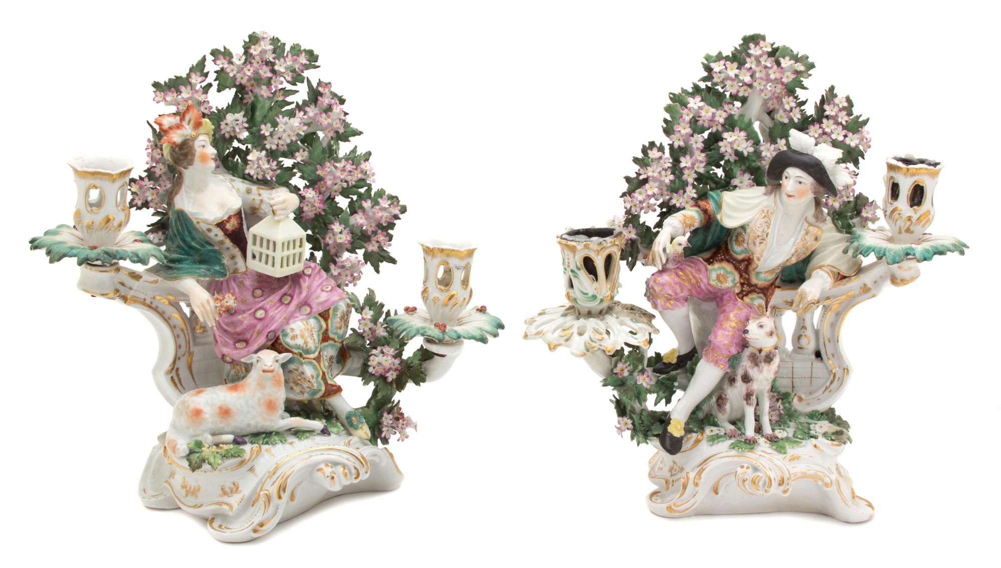 A Pair of German Porcelain Figural Candlesticks Height 11 1/2 inches. — 19TH CENTURY
