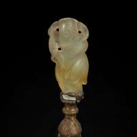A Chinese carved mottled celadon jade figure of Guanyin, mounted as a lamp 玉雕观音改装台灯