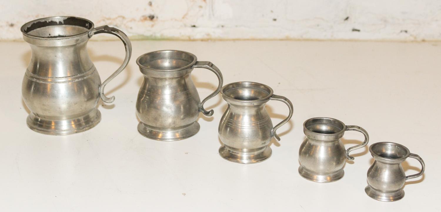 A Set of Five Pewter Jugs. Height of tallest 4 7/8 inches.
