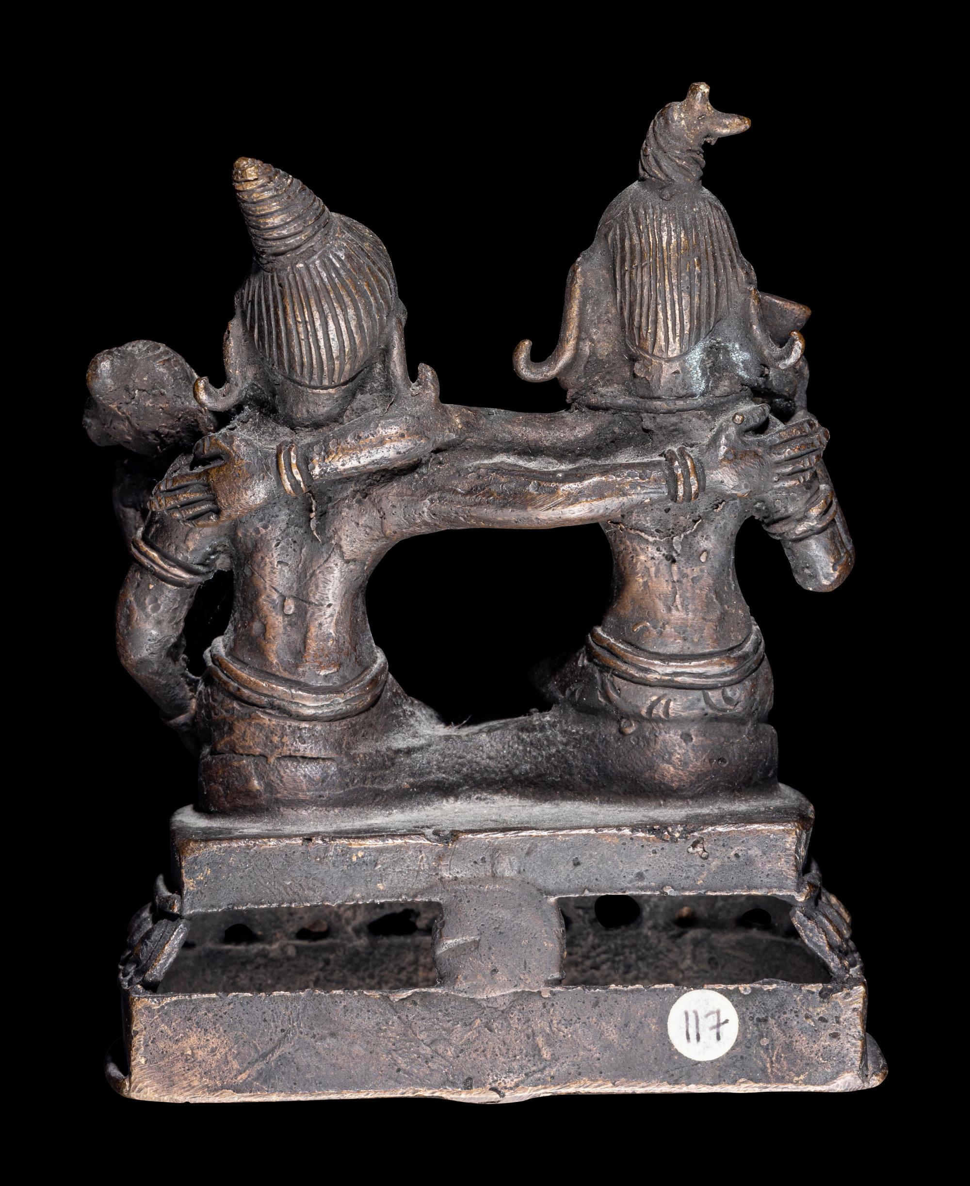 An Indian Bronze Group of Shiva and Parvati with Ganesha