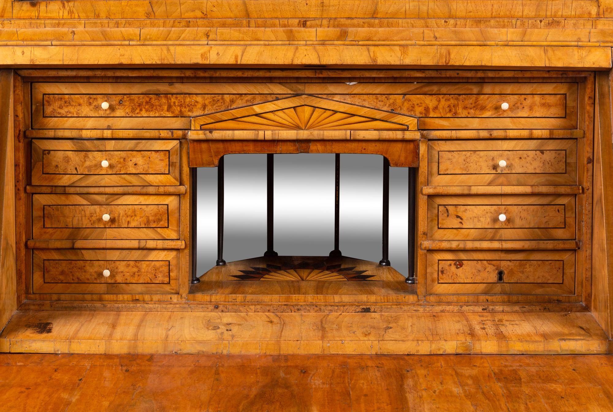 A Biedermeier Figured Walnut Secretary Bookcase