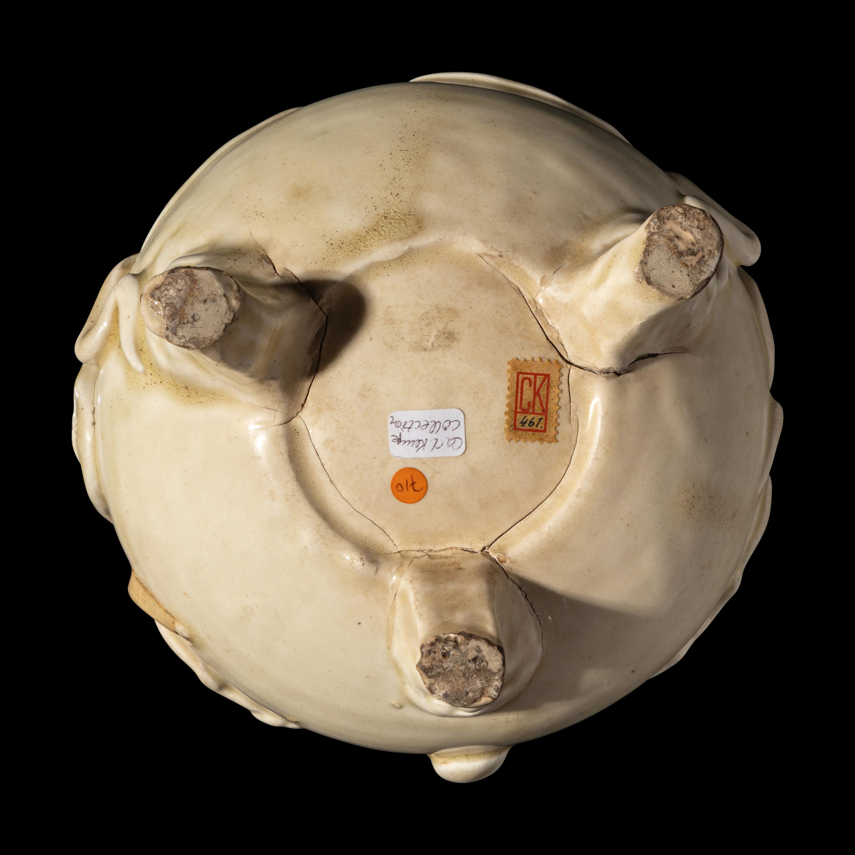 A Chinese White Glazed Tripod Incense Burner, Yuan to Ming Dynasty 元-明 白釉雙龍趕珠紋鬲式爐