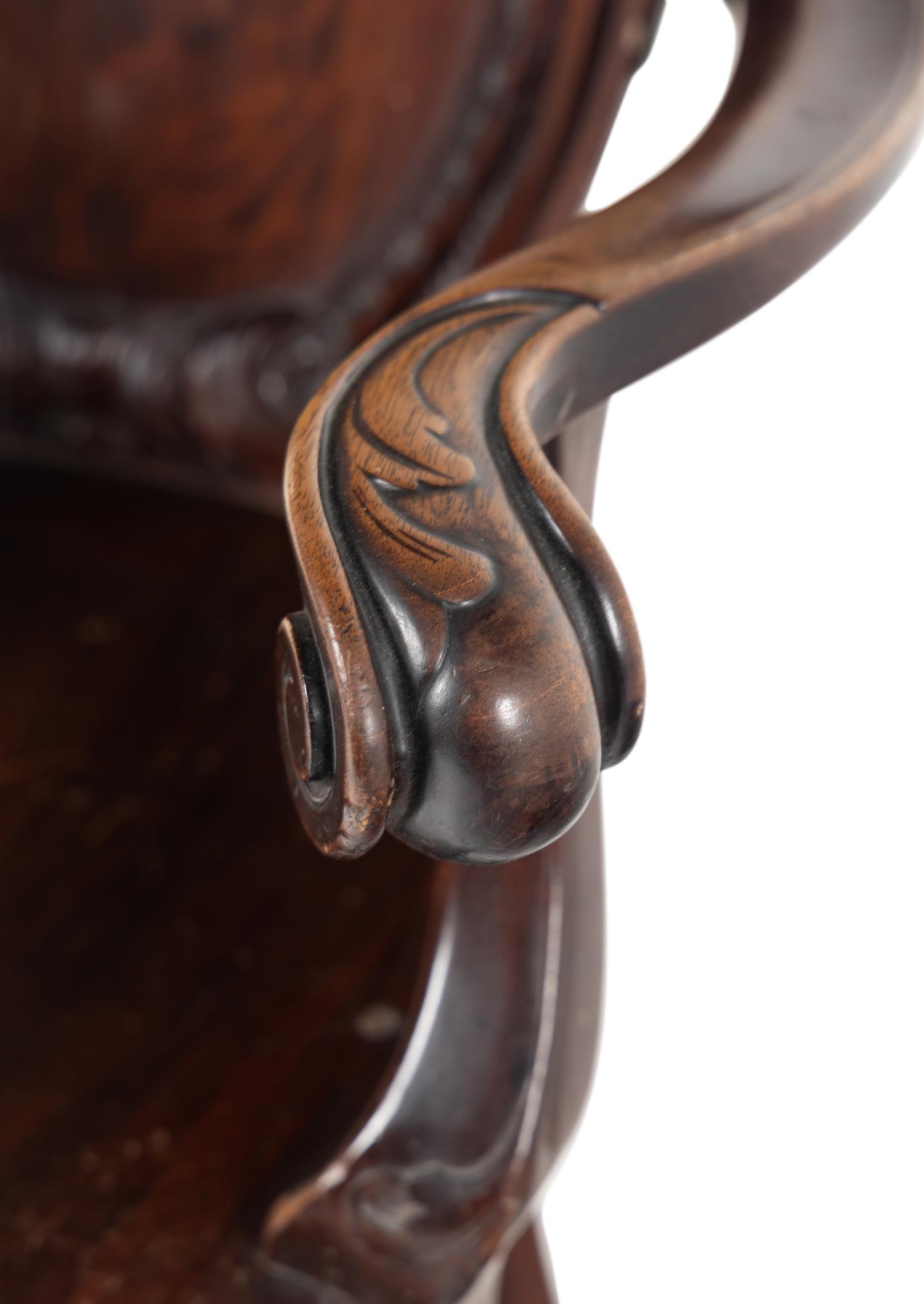 A Baroque Revival Carved Mahogany Armchair