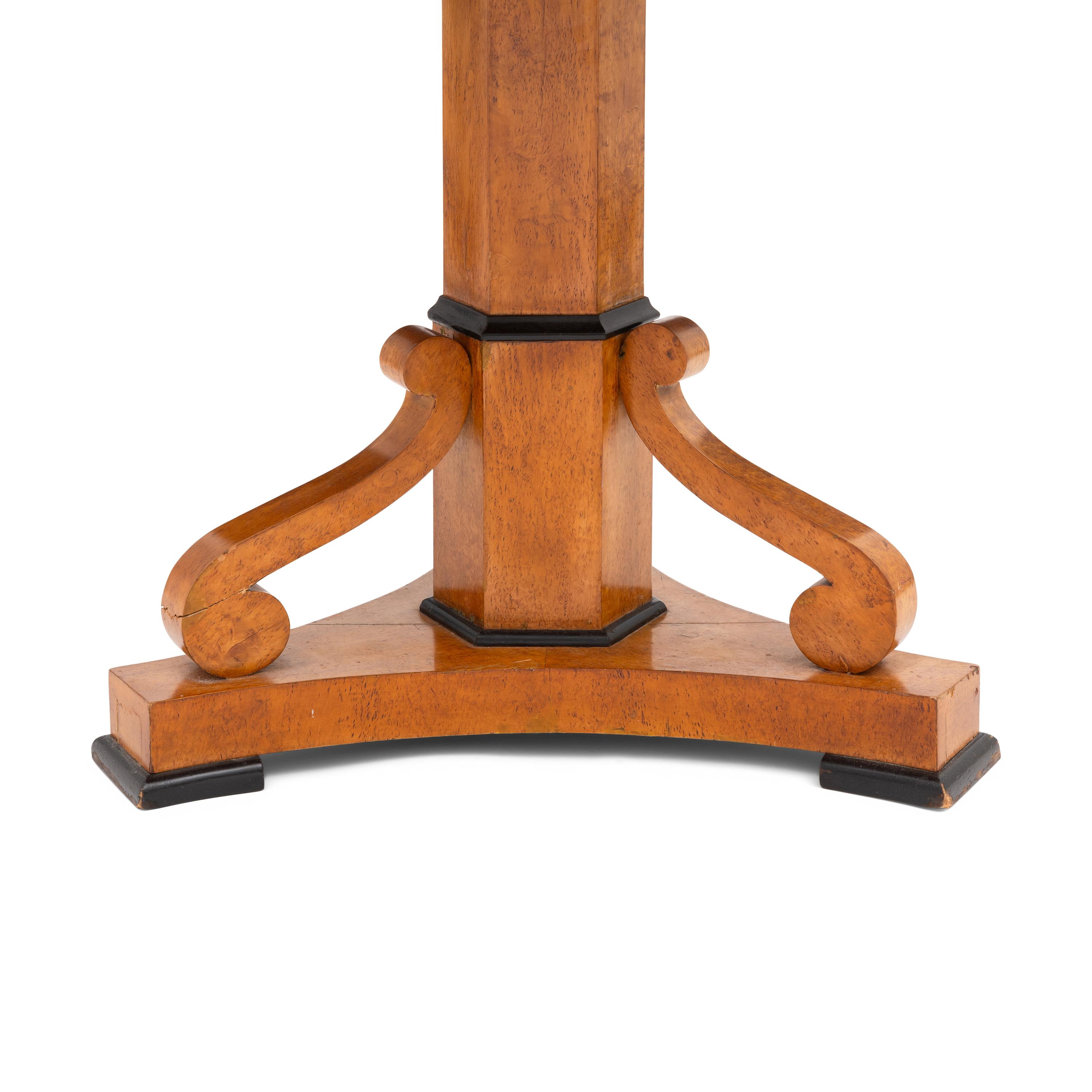 A Biedermeier Birch and Ebonized Center Table