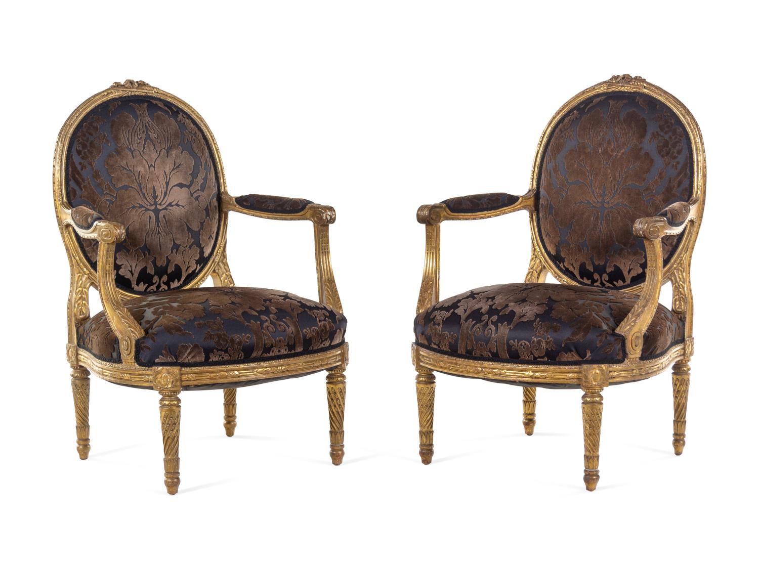 A Pair of Louis XVI Giltwood Fauteuils