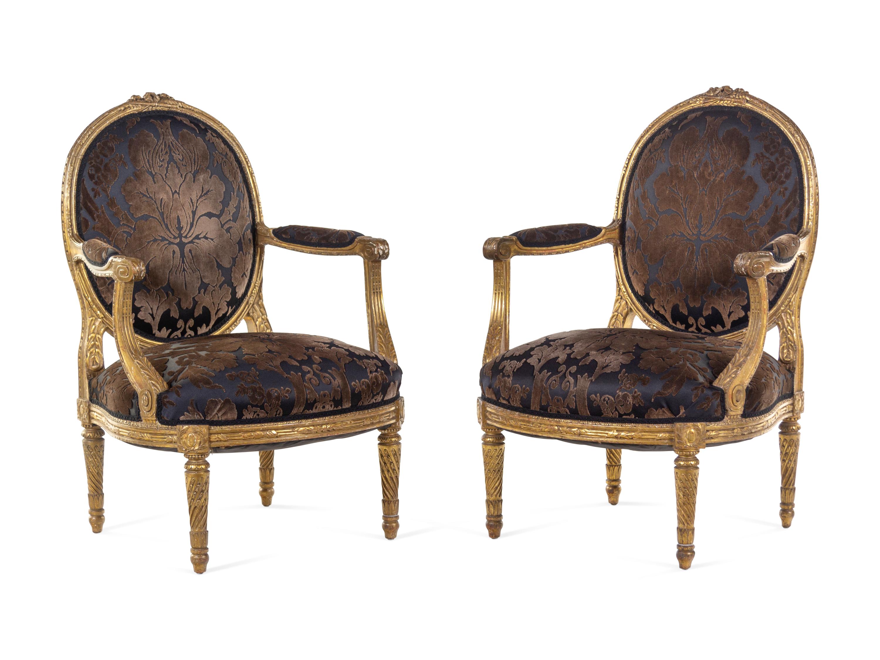 A Pair of Louis XVI Giltwood Fauteuils