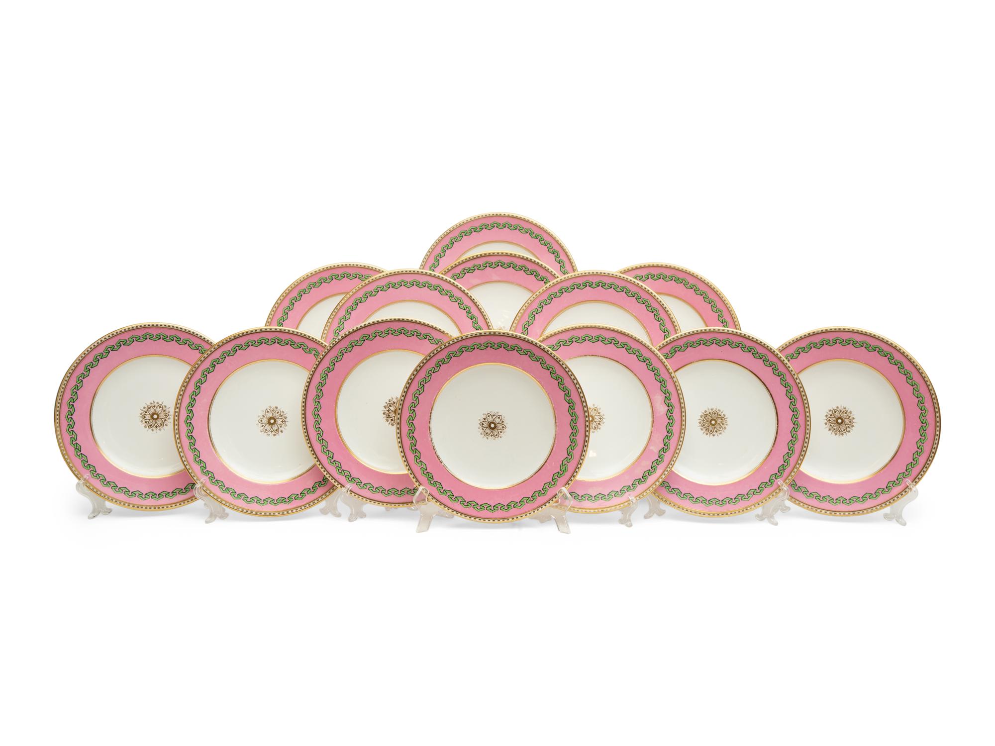 A Set of Thirteen Pink and Green Painted Porcelain Luncheon Plates