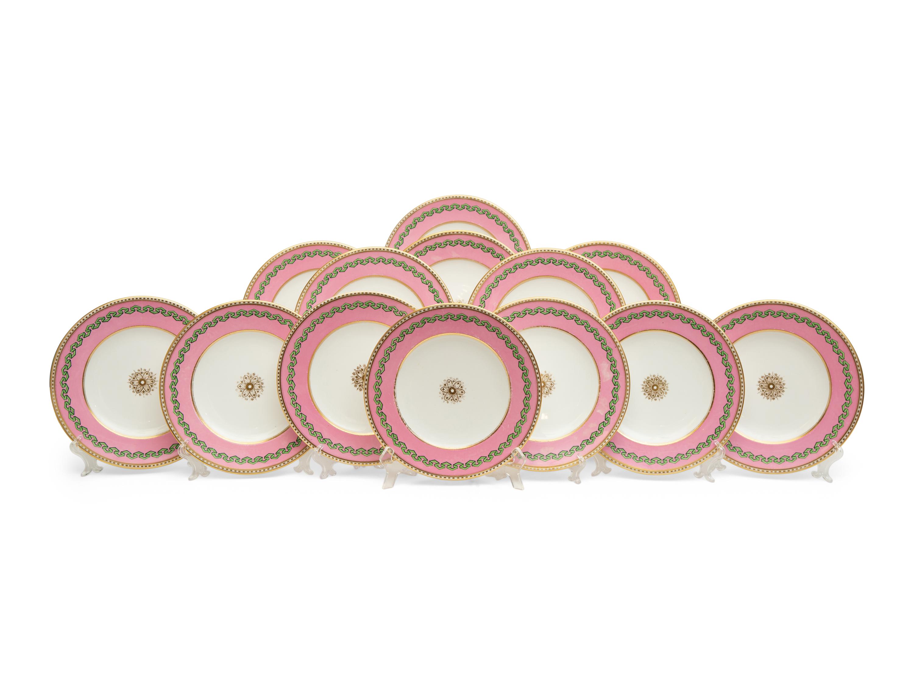 A Set of Thirteen Pink and Green Painted Porcelain Luncheon Plates
