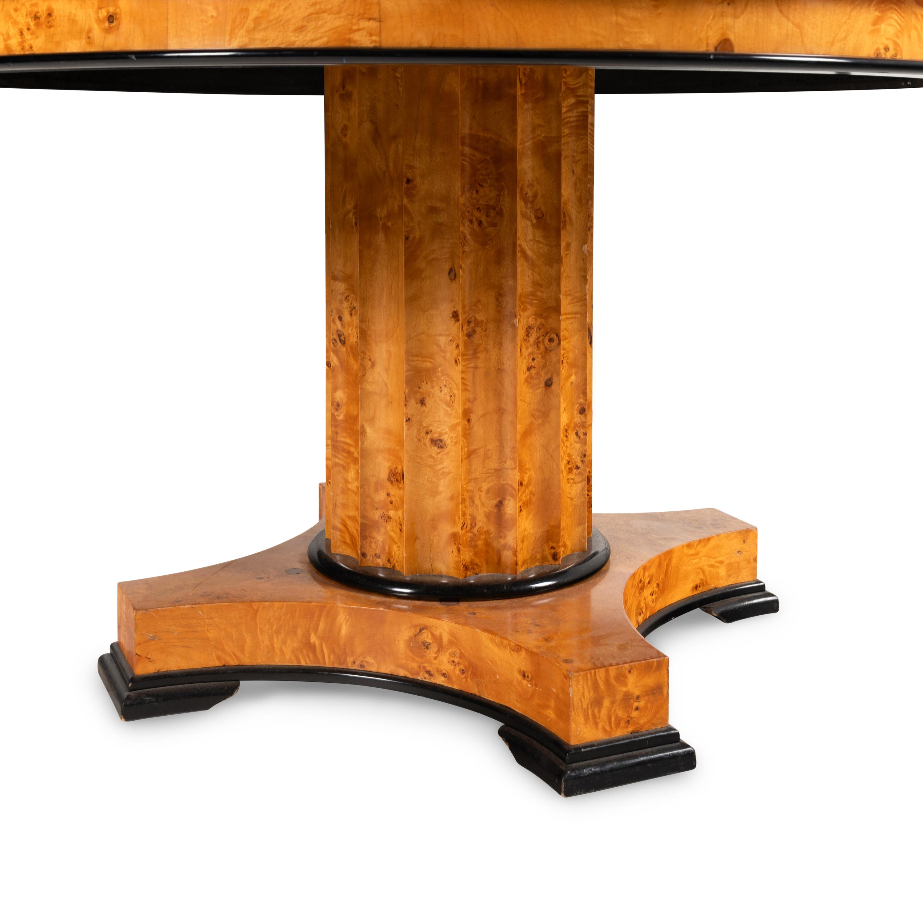 A Biedermeier Style Parcel Ebonized Figured Birch Center Table