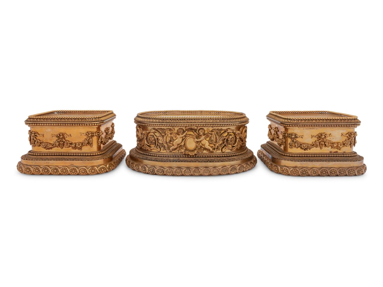 A Group of Three P.E. Guerin Gilt Bronze Garniture Stands