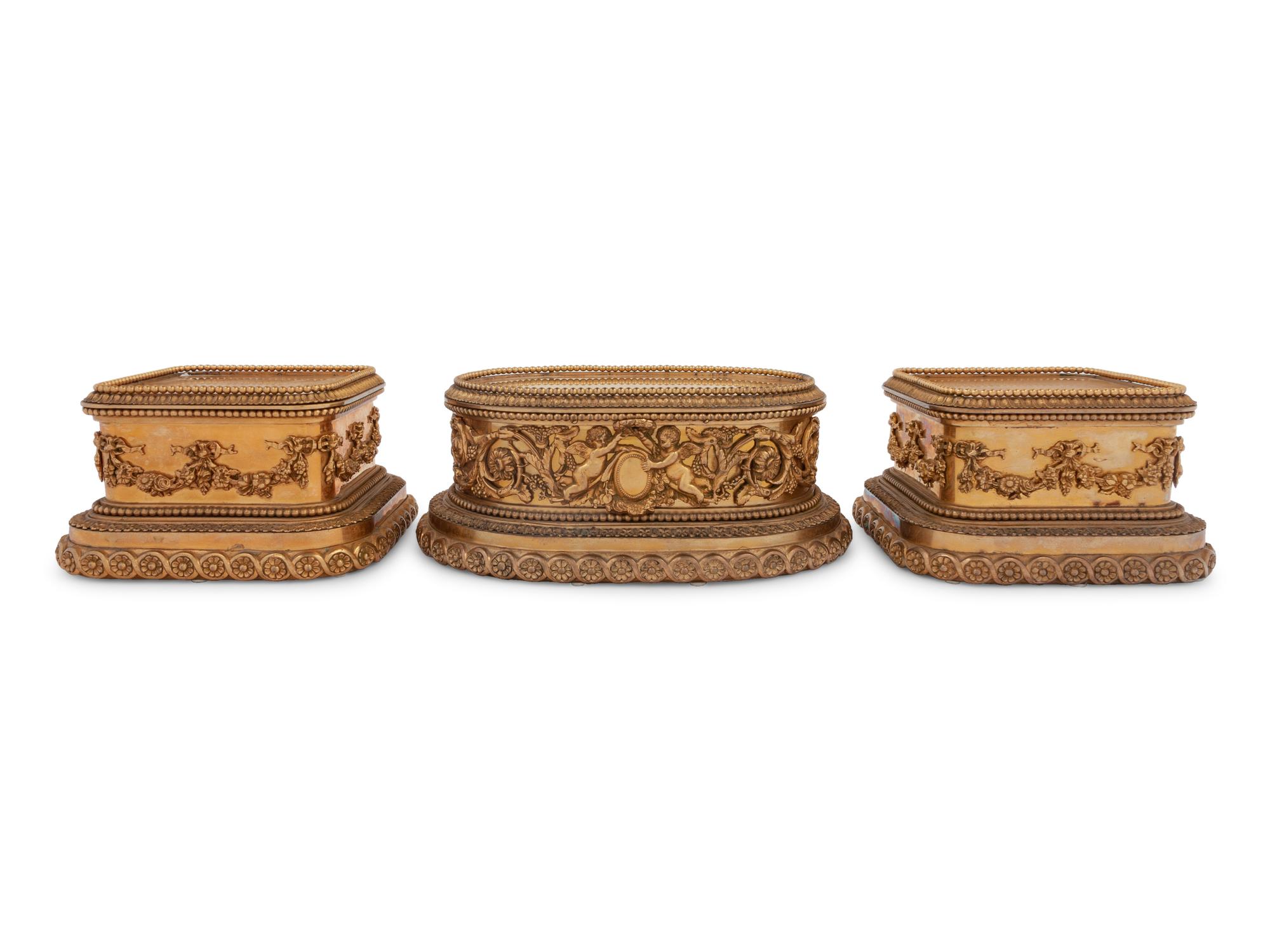 A Group of Three P.E. Guerin Gilt Bronze Garniture Stands