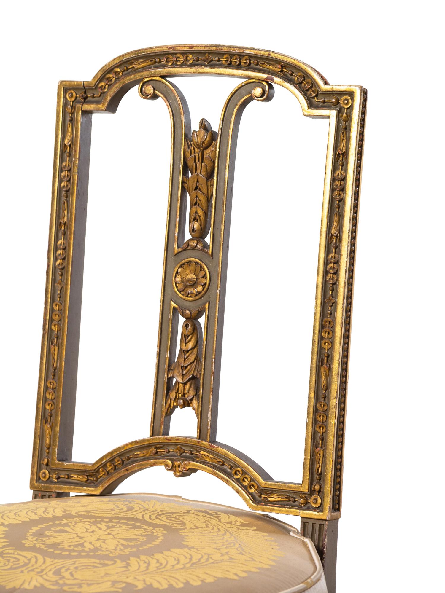 A Pair of Louis XVI Style Painted and Parcel Gilt Side Chairs