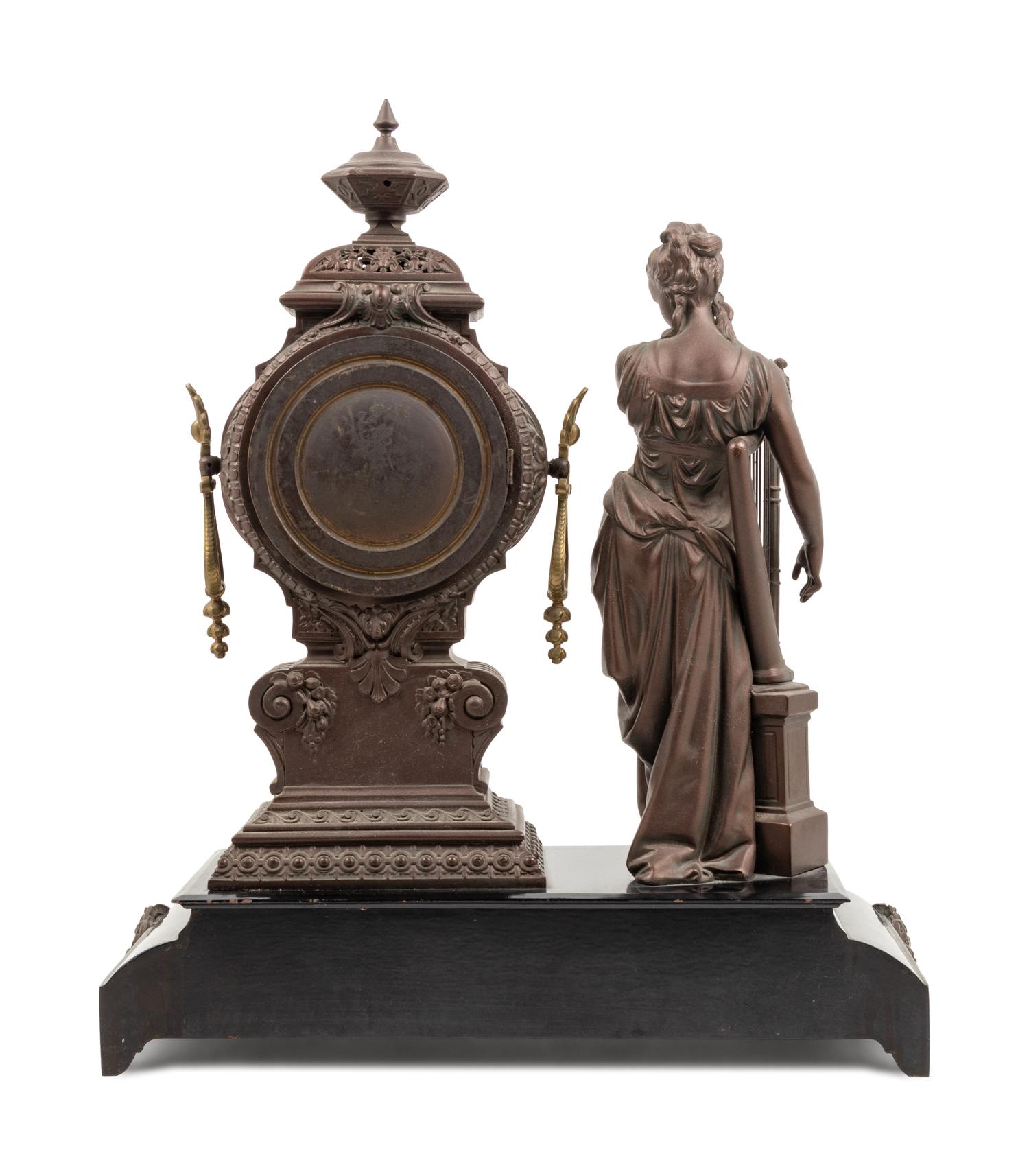 An Ansonia Music Patinated Metal Mantel Clock