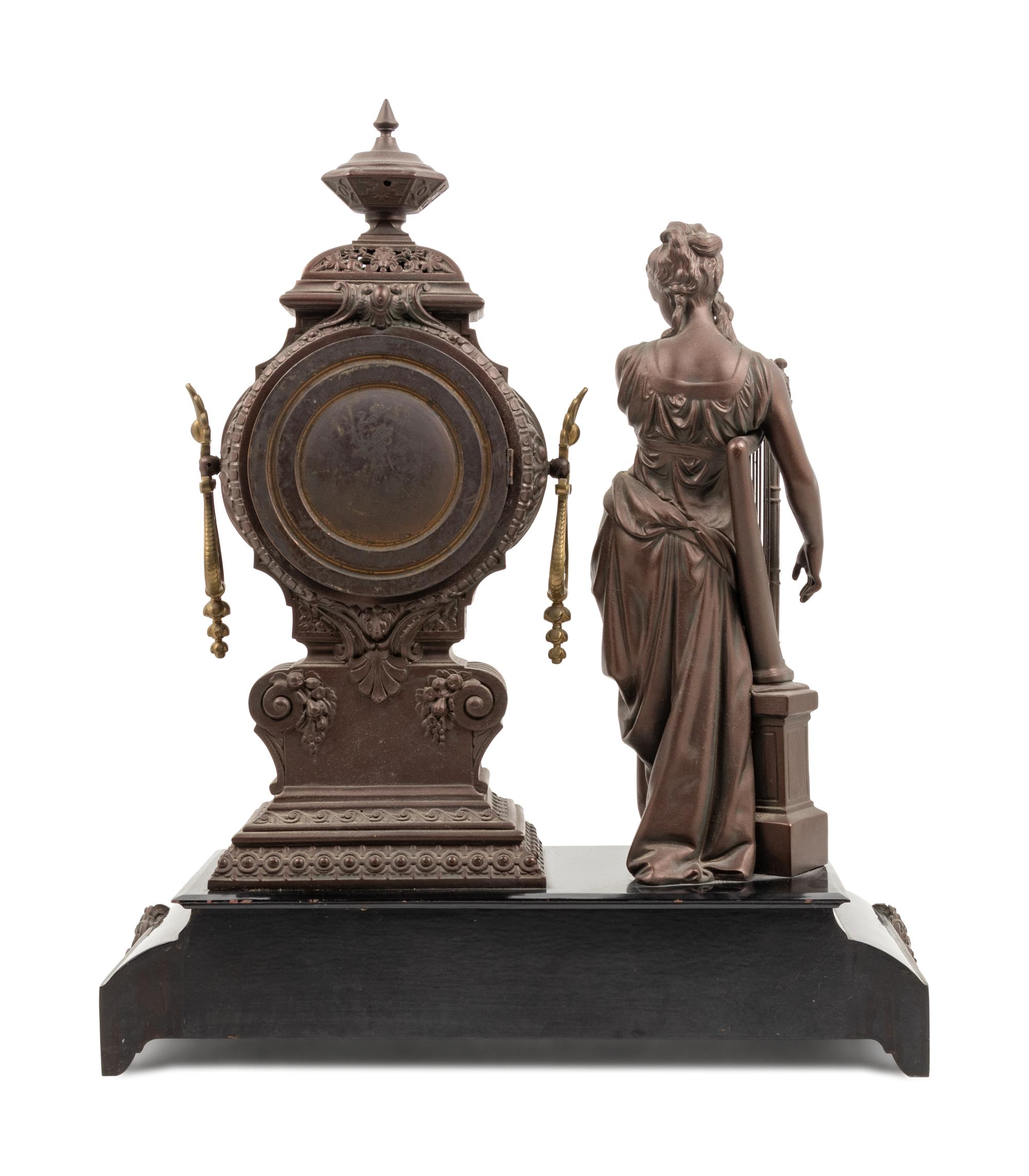 An Ansonia Music Patinated Metal Mantel Clock