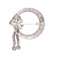 Diamond and Platinum Circle Brooch with Articulated Bow