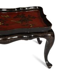 A Lacquered and Gilt Decorated Chinoiserie Tray Top Table