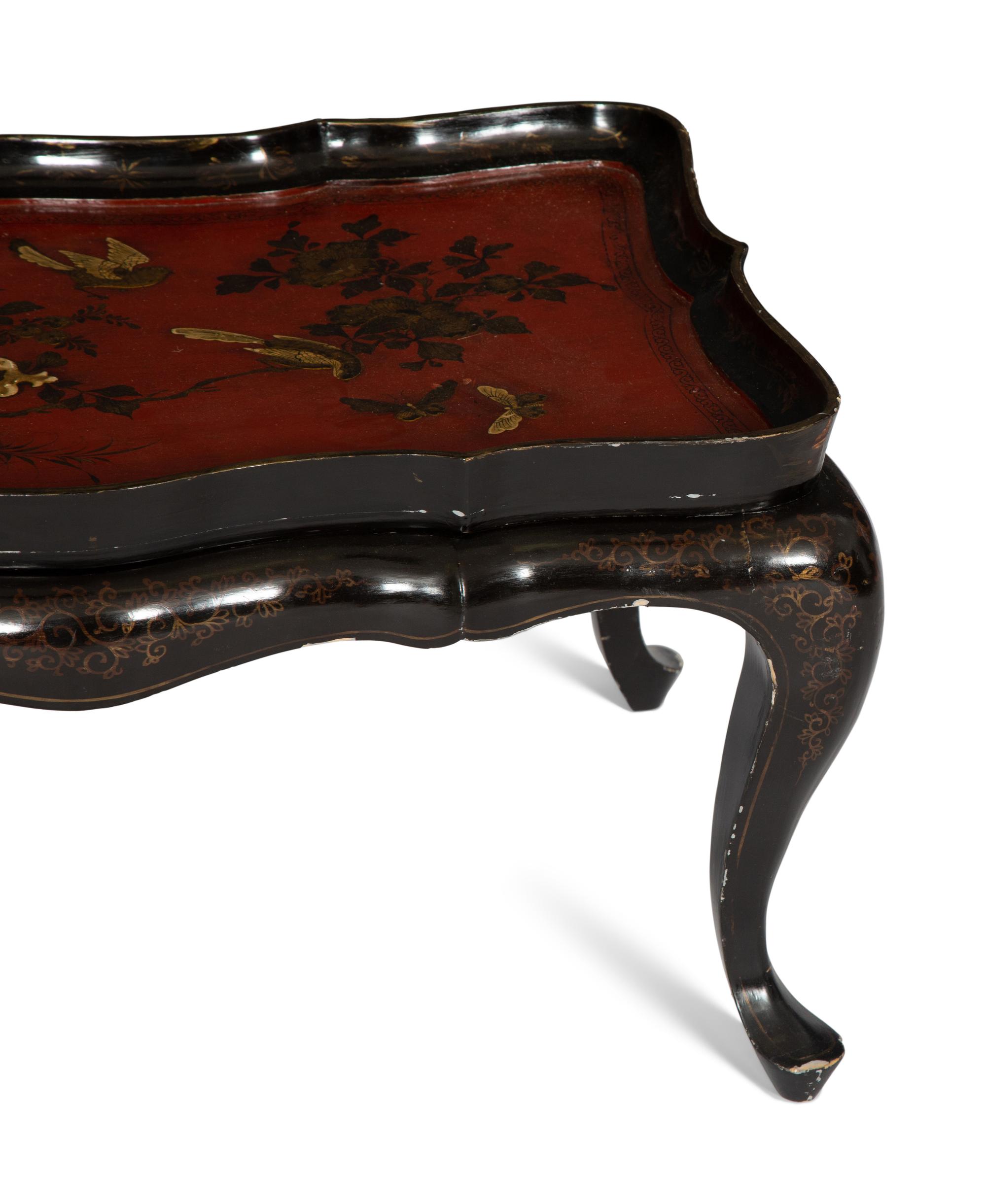 A Lacquered and Gilt Decorated Chinoiserie Tray Top Table