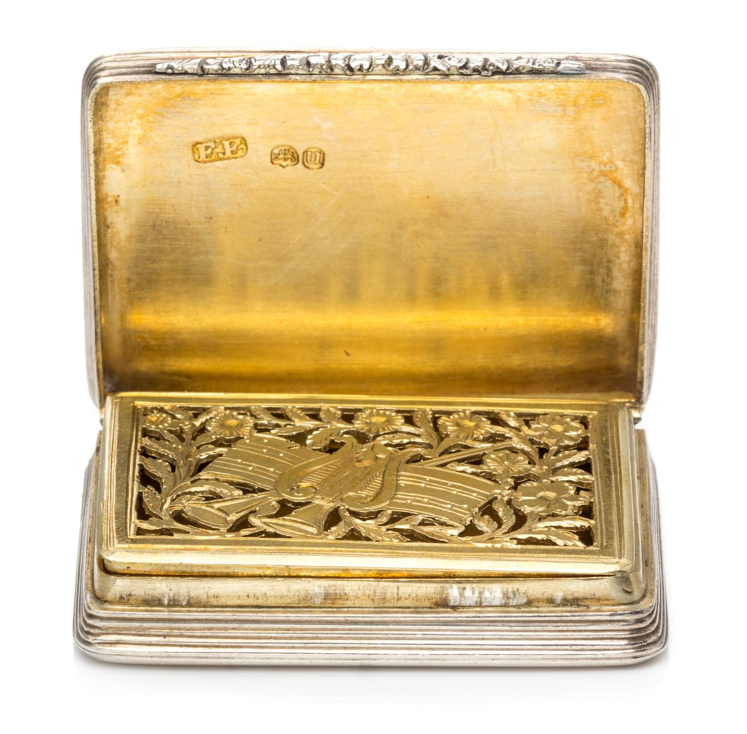 A Silver Vinaigrette, With spurious Georgian marks, having an engine turned decorated case centered by a vacant cartouche.