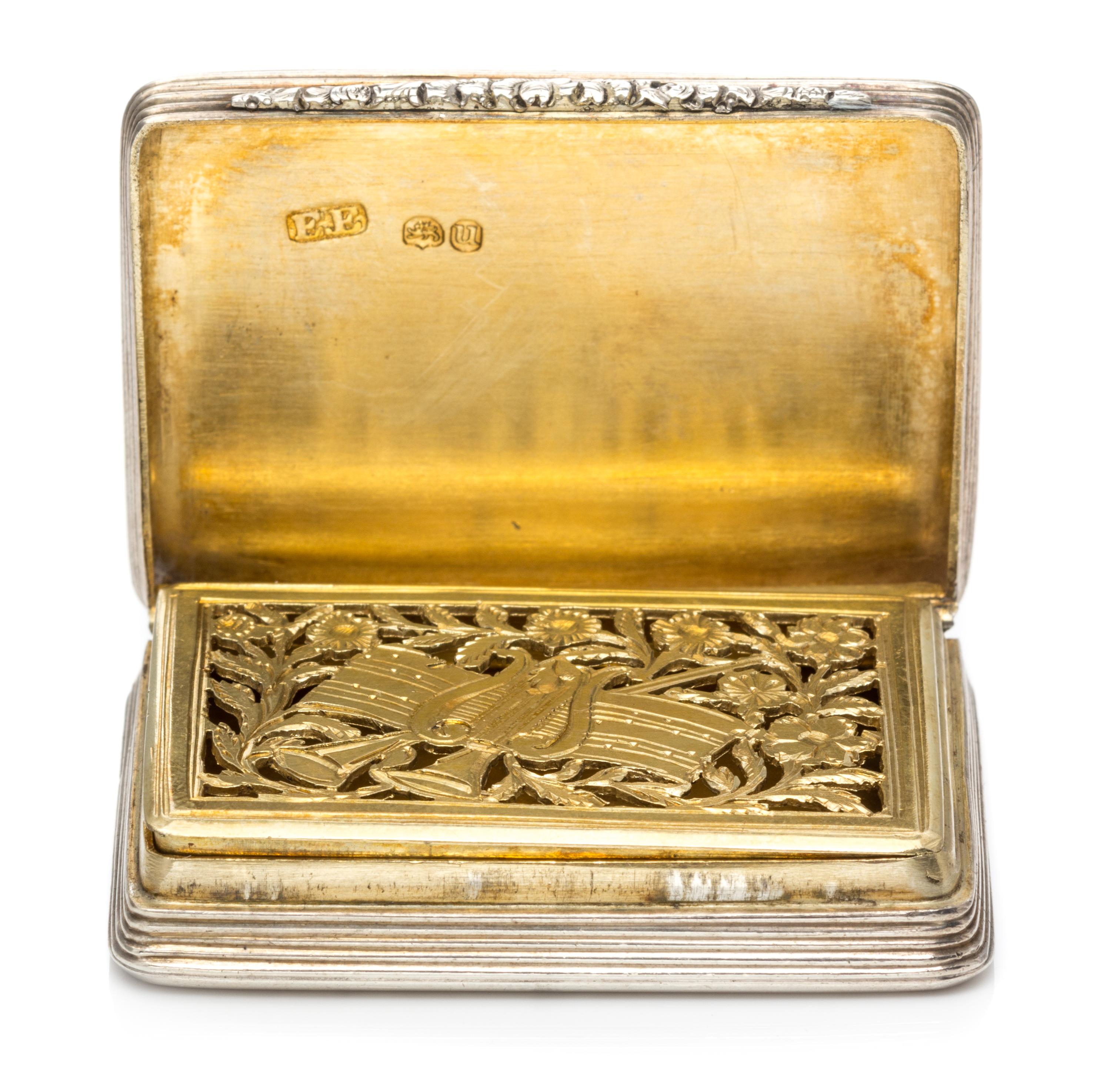 A Silver Vinaigrette, With spurious Georgian marks, having an engine turned decorated case centered by a vacant cartouche.