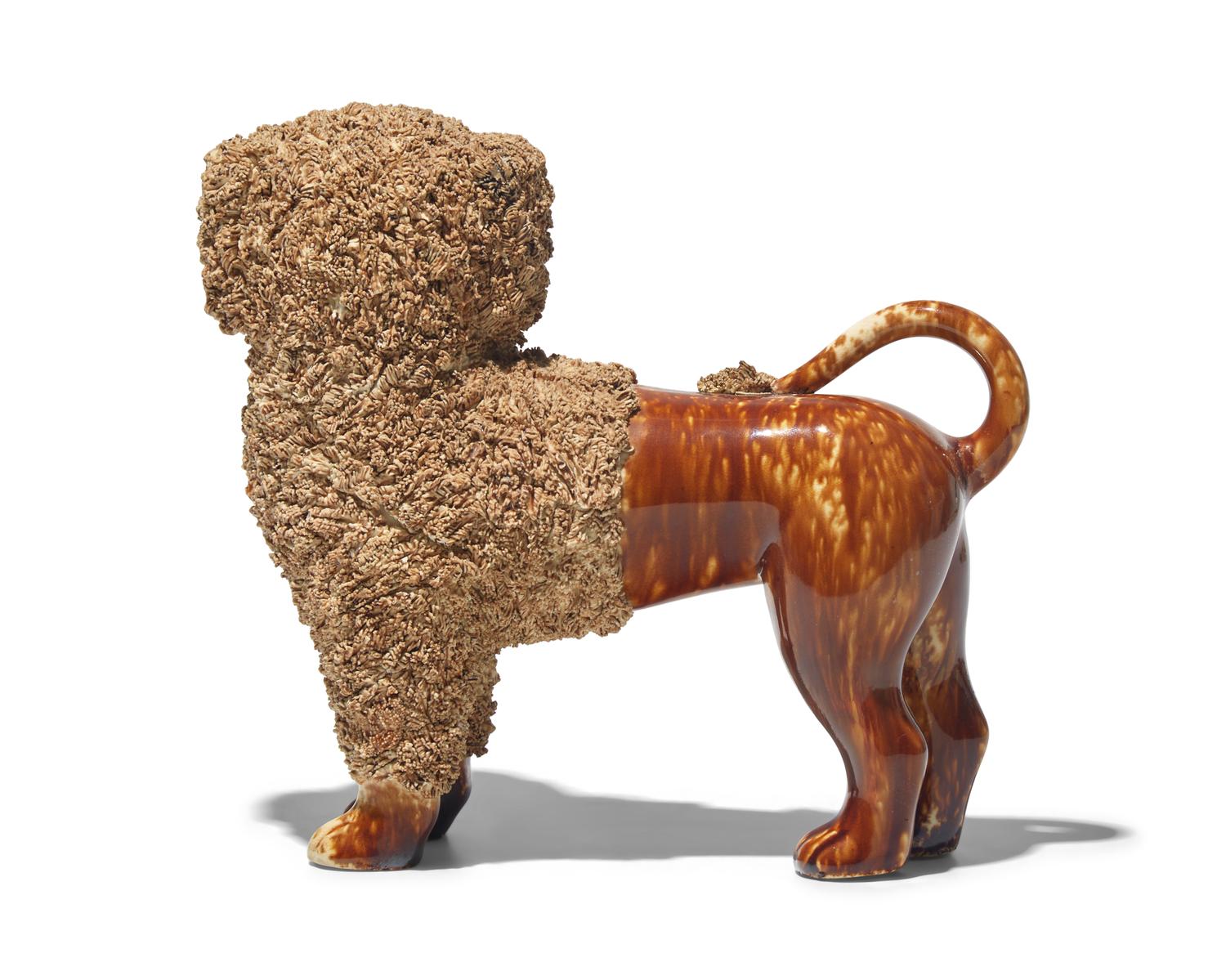 A Bennington Glazed Spaniel with Basket
