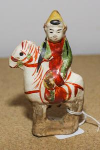A Red and Green Glazed Pottery Equestrian Figure Height 4 1/4 inches.