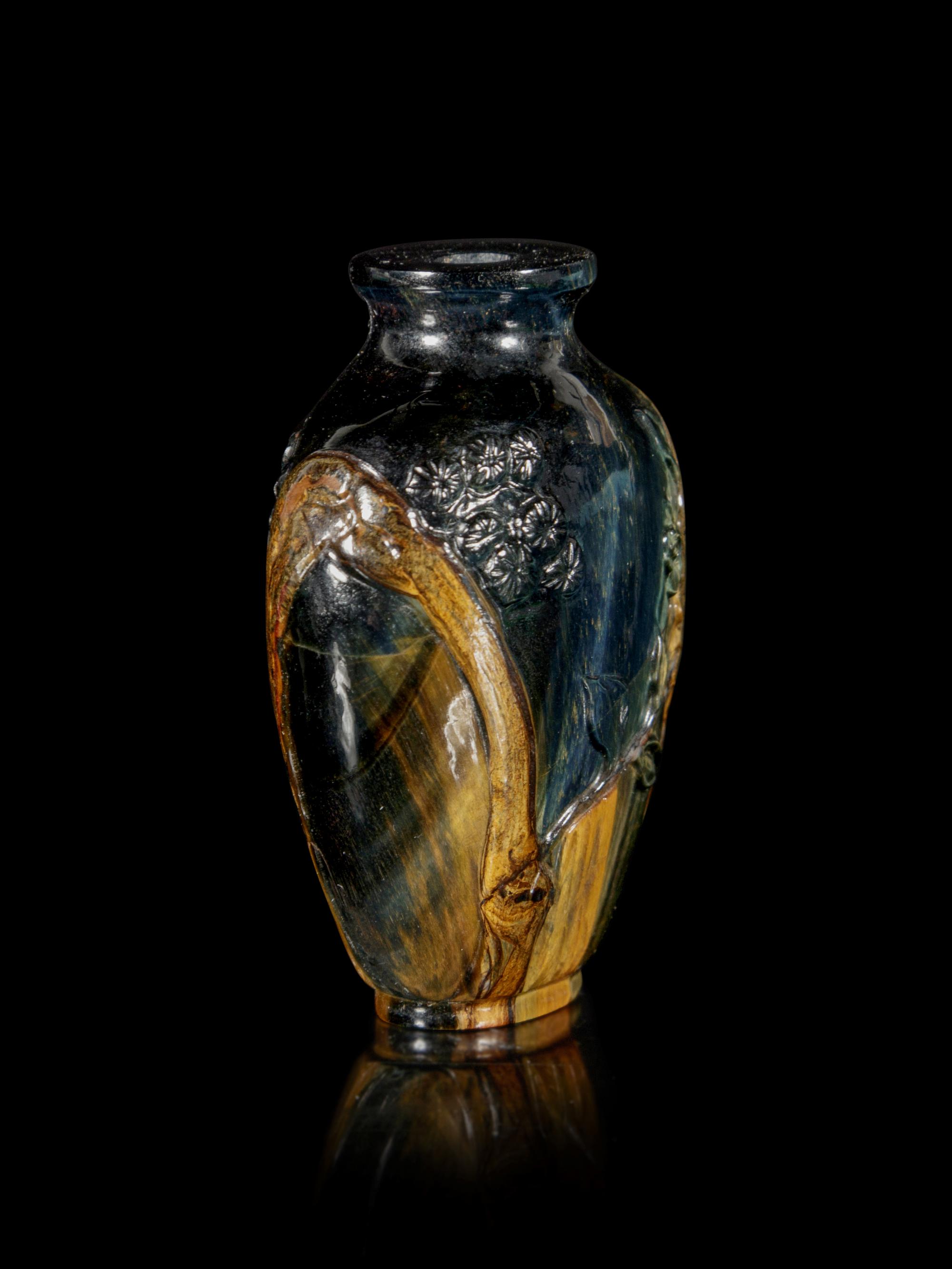 A Carved Tiger’s Eye Snuff Bottle