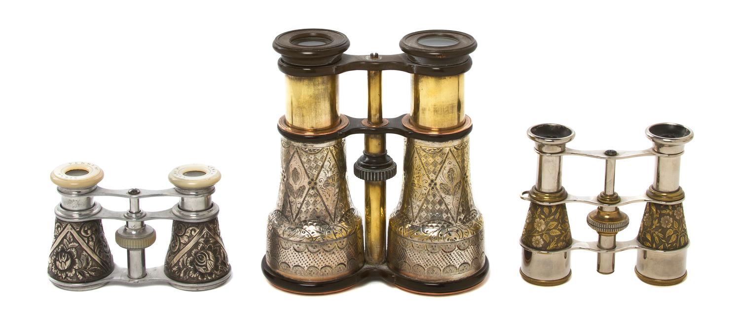 Two Pairs of Silvered Metal Cased Opera Glasses, Width of widest 4 3/4 inches.