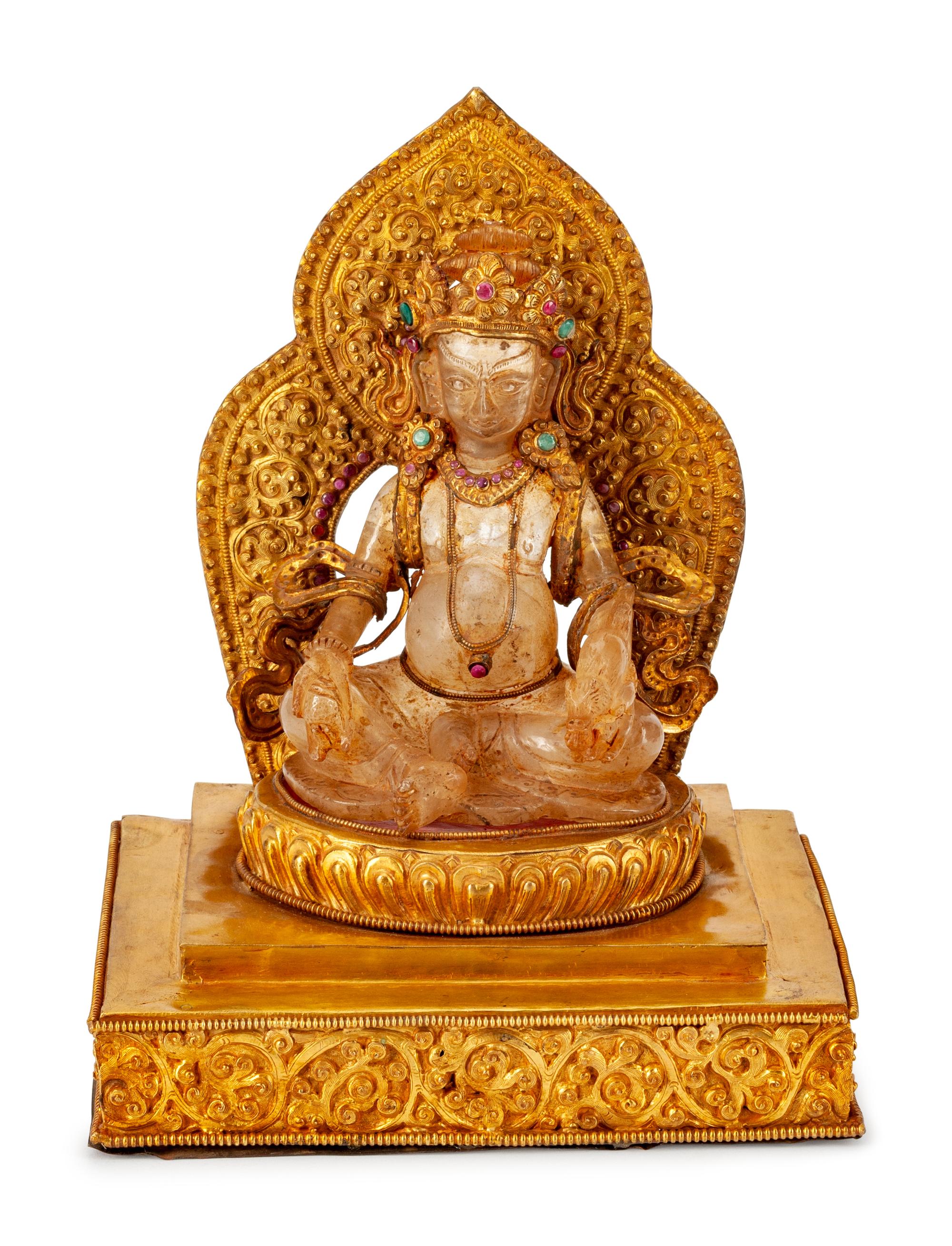 A Chinese Rock Crystal Figure of a Seated Deity