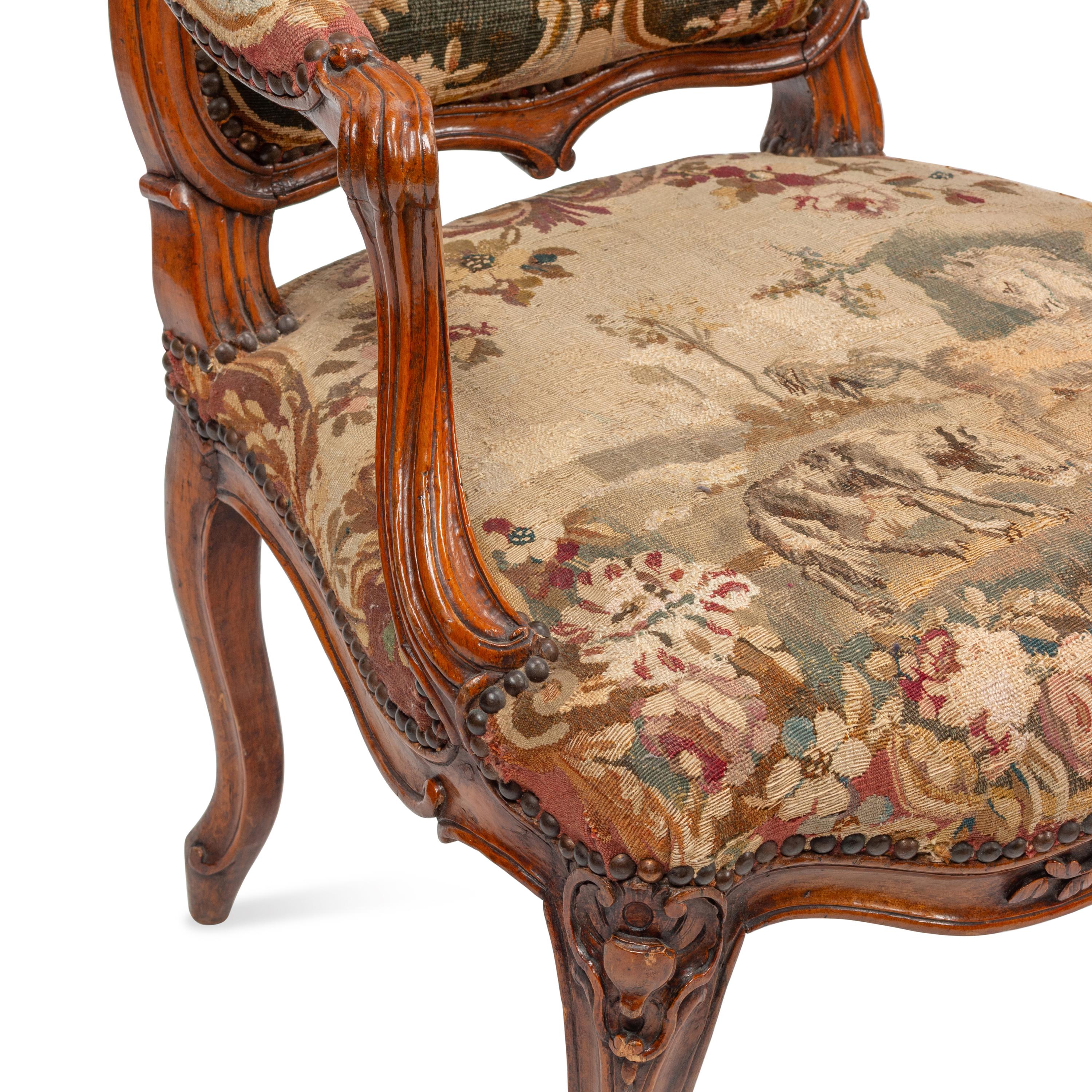 A Set of Four Louis XV Tapestry-Upholstered Armchairs