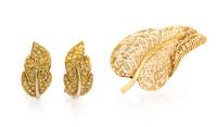 A Pair of 18 Karat Yellow Gold and Colored Diamond Earclips, 12.90 dwts.