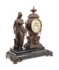 An Ansonia Music Patinated Metal Mantel Clock