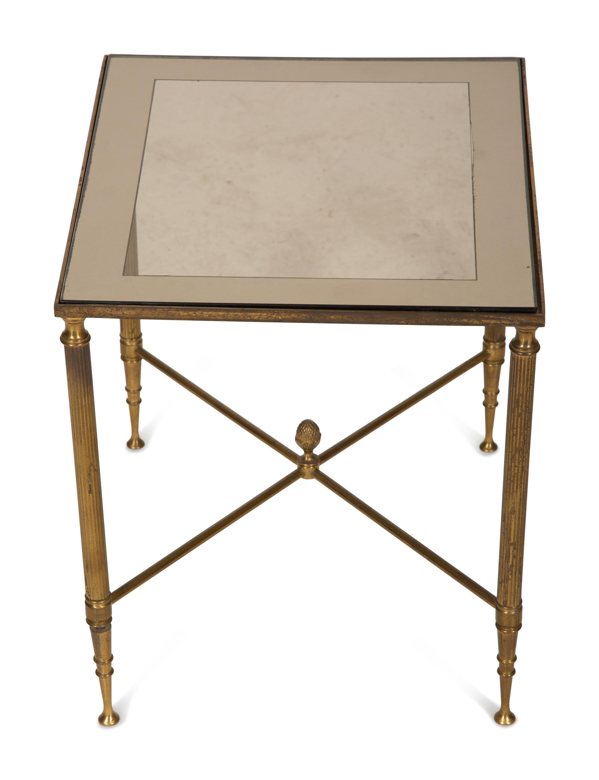 A Set of Three Gilt Metal Nesting Tables in the Style of Maison Jansen
