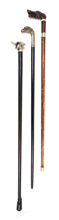 Three Figural Handled Sword Canes Length of longest 37 5/8 inches.