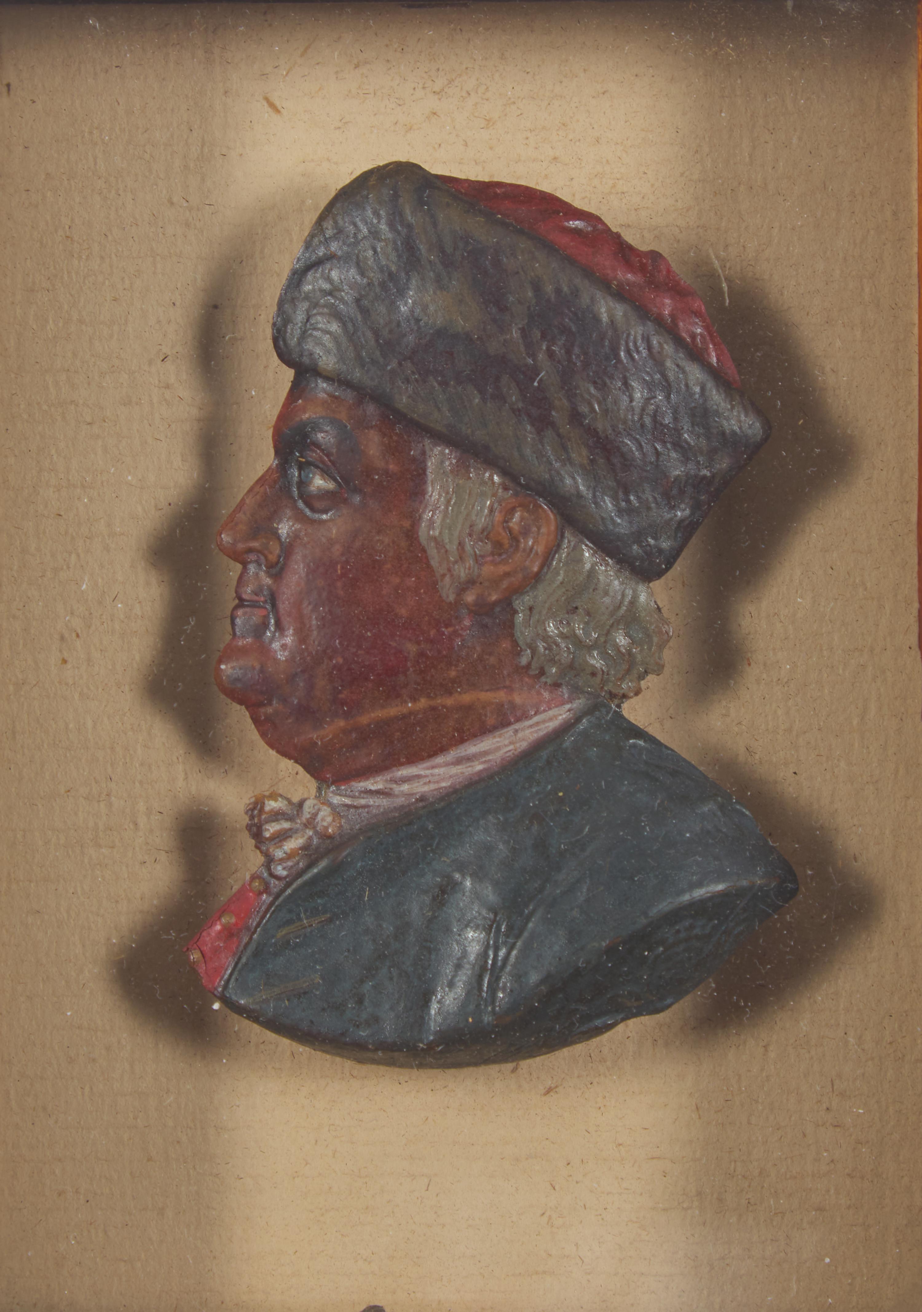 American School 19th Century, A Colored Wax Profile Portrait Bust of Benjamin Franklin with Fur Hat