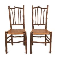 A Pair of Old Hickory Style Side Chairs with Reed Seats
