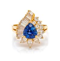 An 18 Karat Yellow Gold, Tanzanite and Diamond Ring, 3.70 dwts.