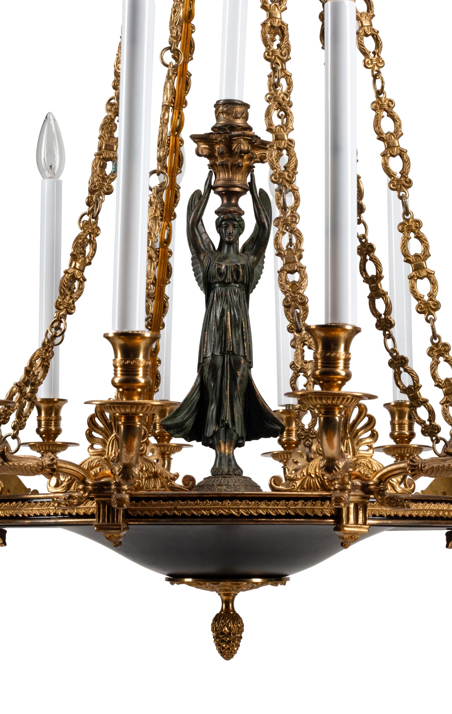 An Empire Style Gilt Bronze and Tole Sixteen-Light Chandelier