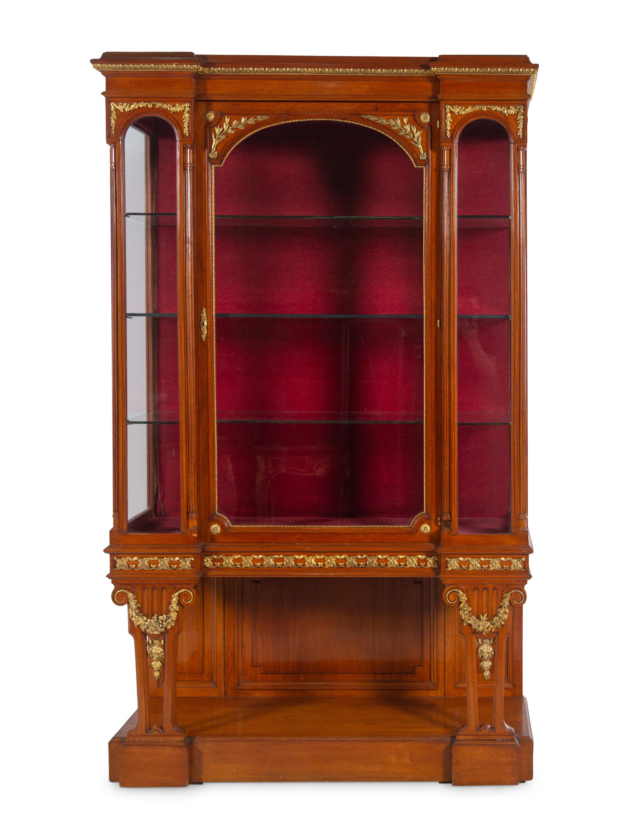 A Pair of Louis XVI Style Gilt Bronze and Metal Mounted Walnut Vitrine Cabinets
