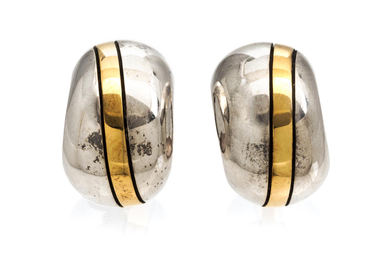 A Pair of Cartier Sterling Silver and 18 Karat Yellow Gold Hoop Earrings, Cartier, 6.60 dwts.