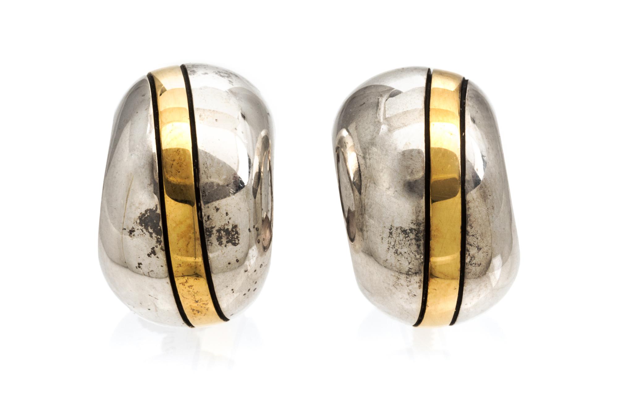 A Pair of Cartier Sterling Silver and 18 Karat Yellow Gold Hoop Earrings, Cartier, 6.60 dwts.