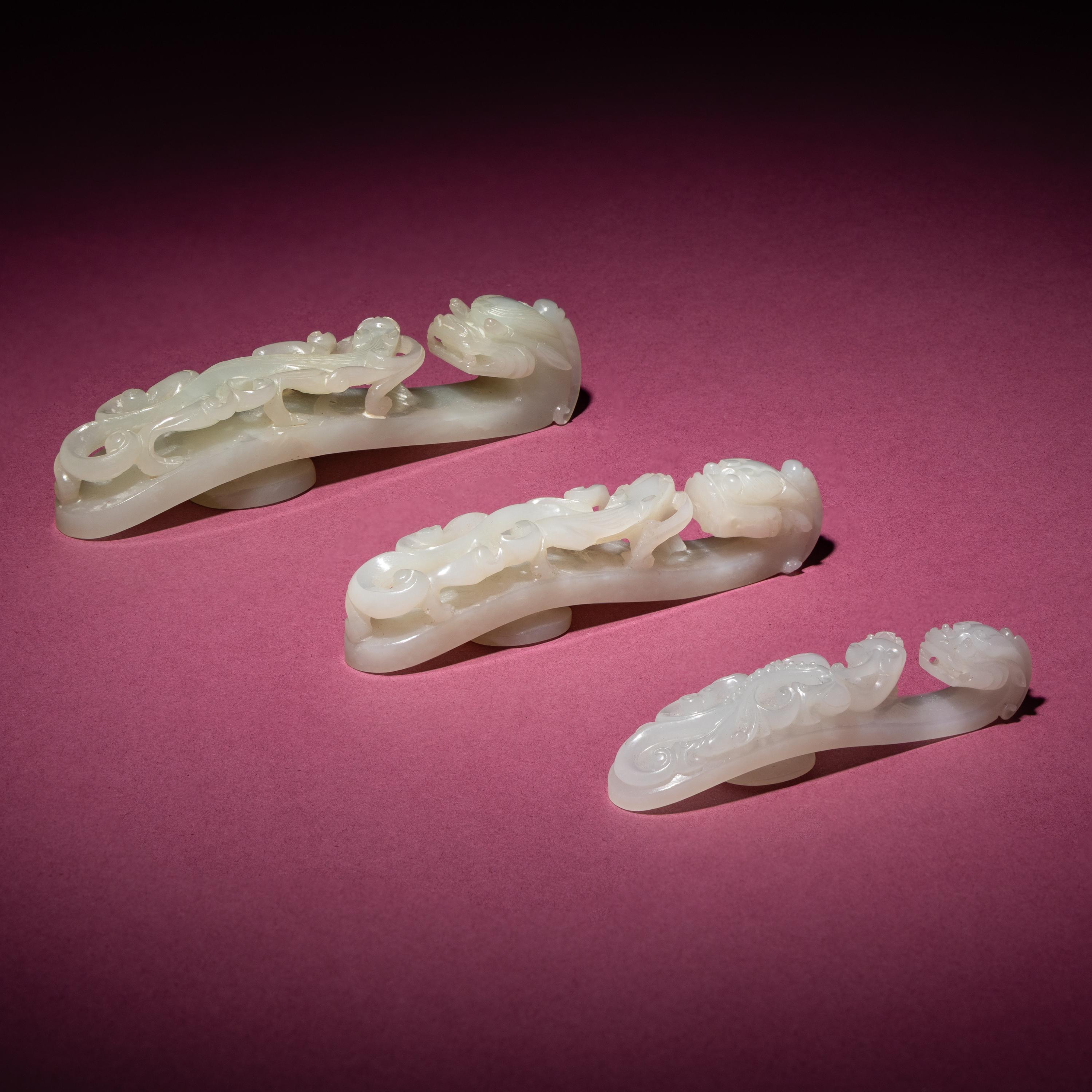 Three Chinese Jade 'Dragon' Belt Hooks, Daigou, 18th/19th Century — 清中期 玉龍鈎三枚