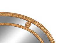 A Giltwood Oval Mirror [RETURNED TO OWNER]