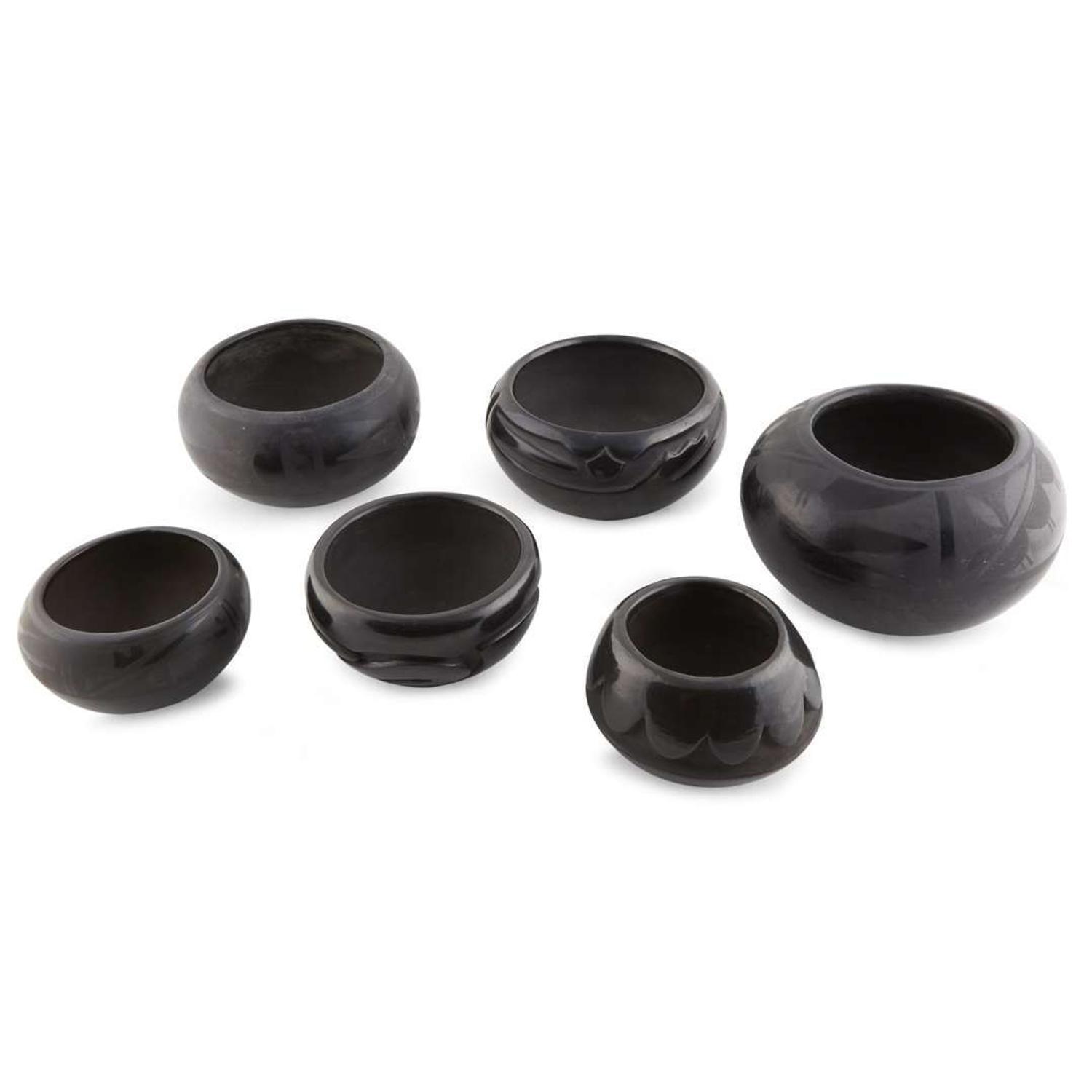 Group of six San Ildefonso and Santa Clara blackware items 20th century