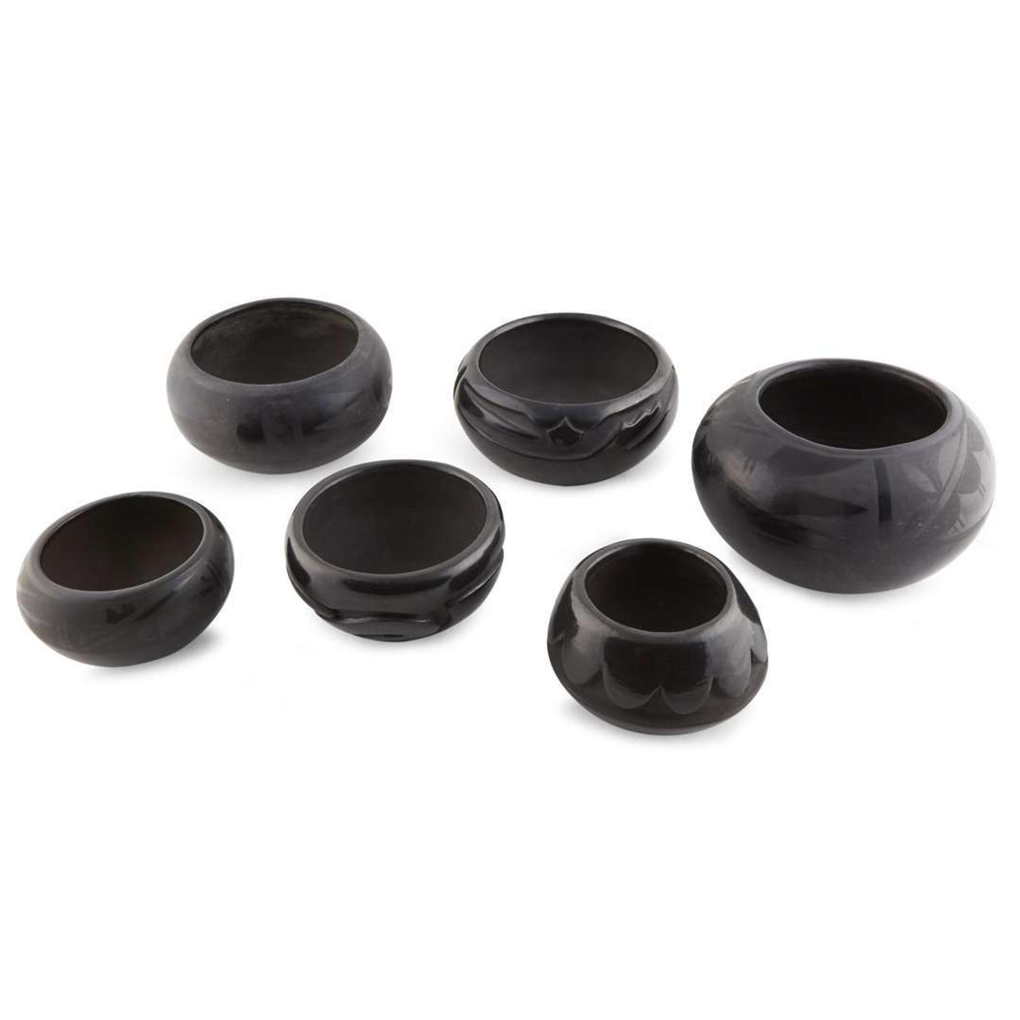 Group of six San Ildefonso and Santa Clara blackware items 20th century
