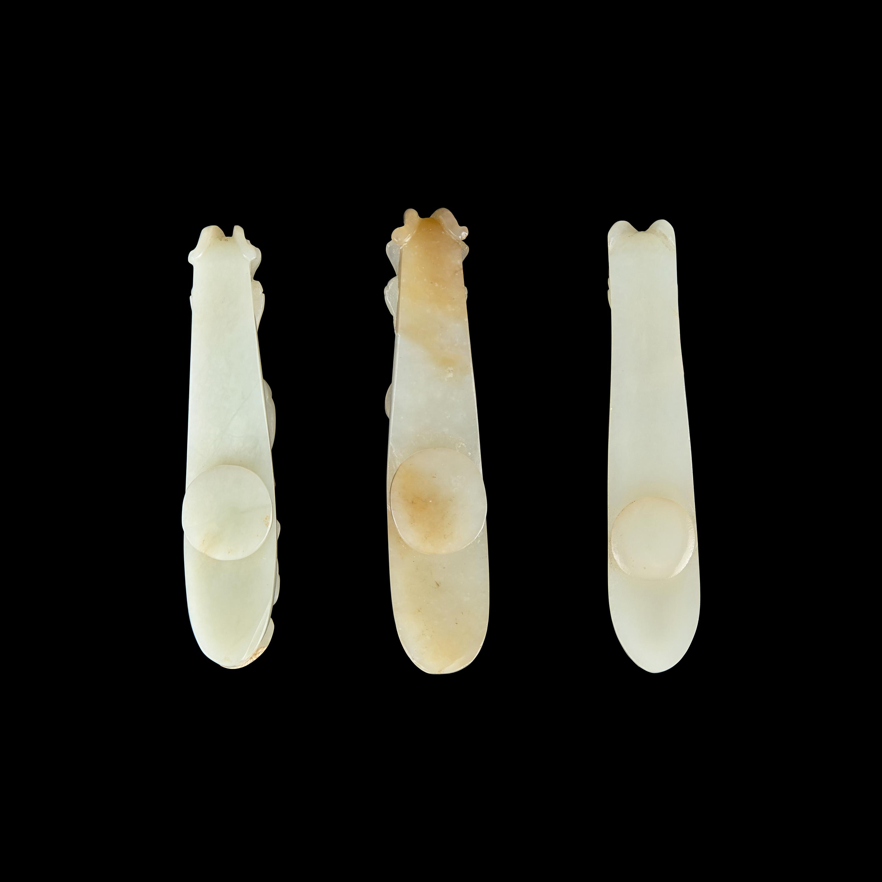 Three Greyish White Jade 'Dragon' Belt hooks, Qing Dynasty 清 灰白玉龍鈎三枚