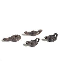 Four Roman Molded Terra Cotta Oil Lamps