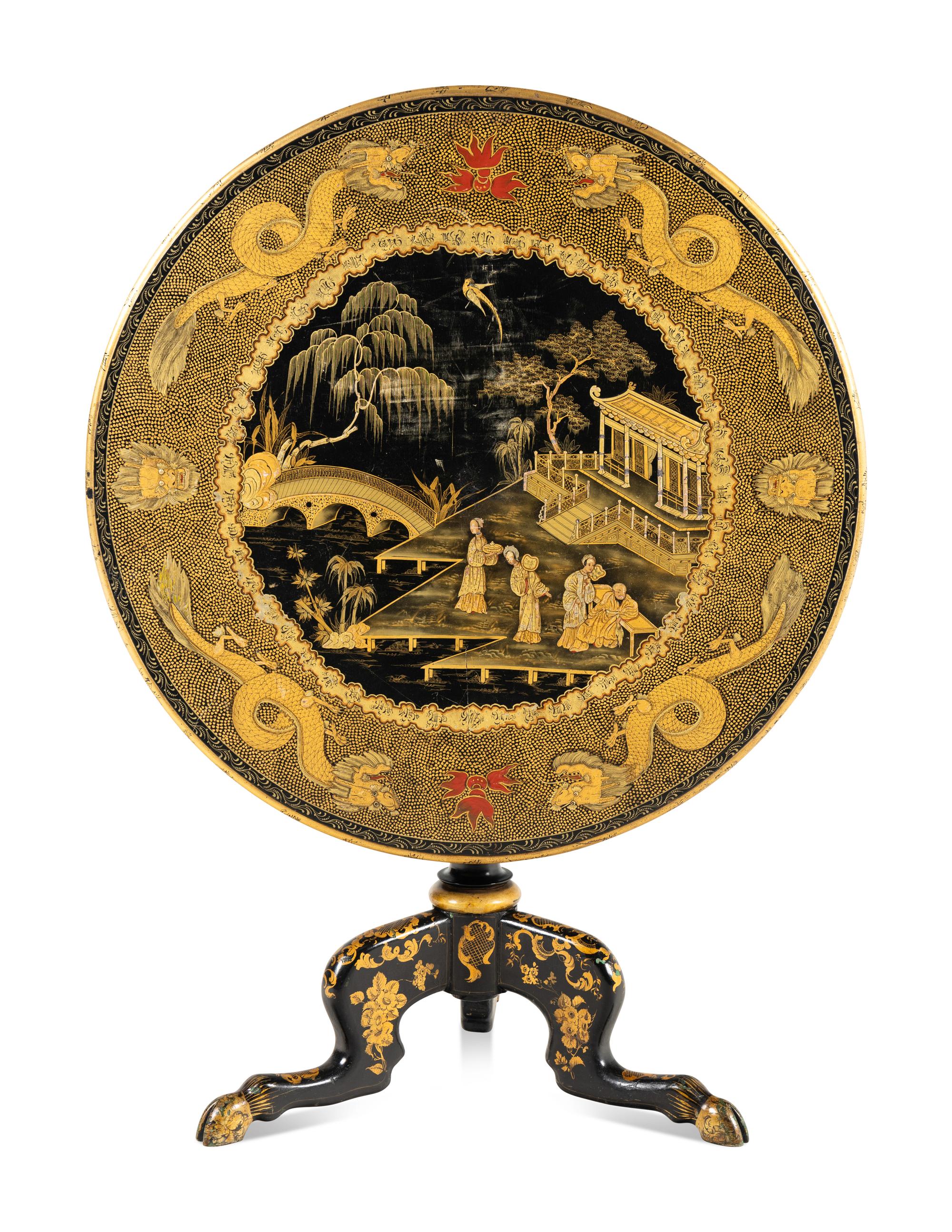 A Regency Style Lacquered and Gilt Decorated Tilt Top Tea Table