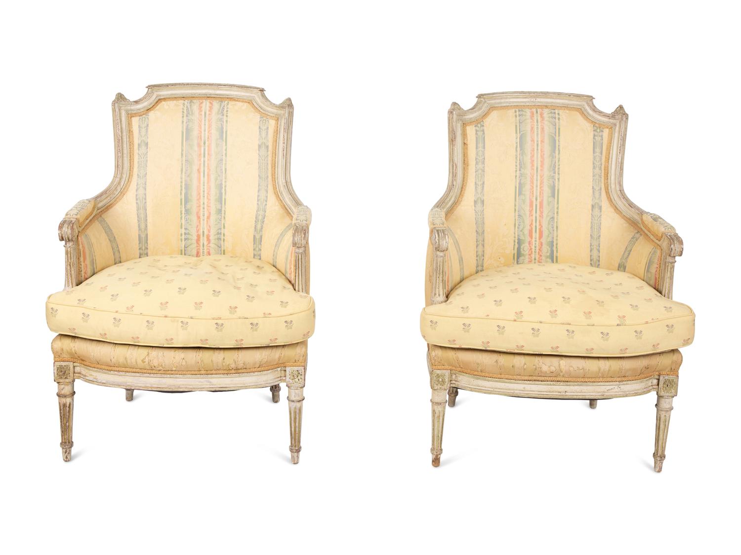 A Pair of Louis XVI Style Painted and Upholstered Bergeres — 20TH CENTURY