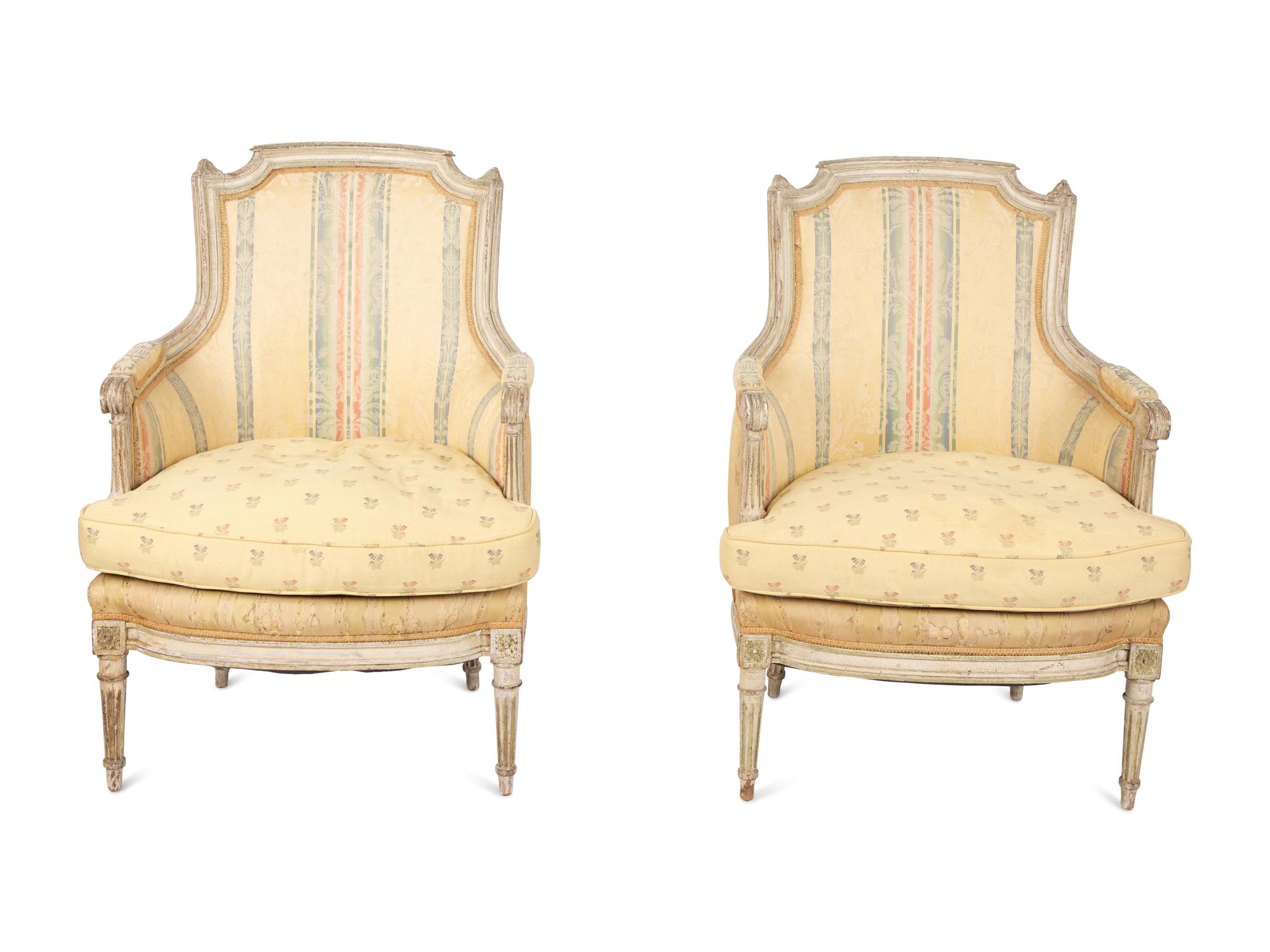 A Pair of Louis XVI Style Painted and Upholstered Bergeres — 20TH CENTURY