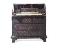 An English Relief-Carved Oak Slant-Front Desk